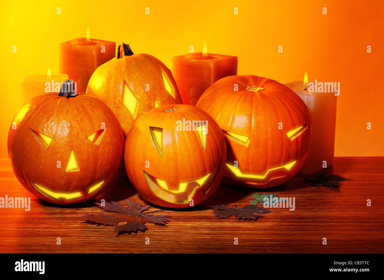 Halloween pumpkin with candles, warm autumn holiday background, traditional  jack-o-lantern, night party decoration Stock Photo - Alamy