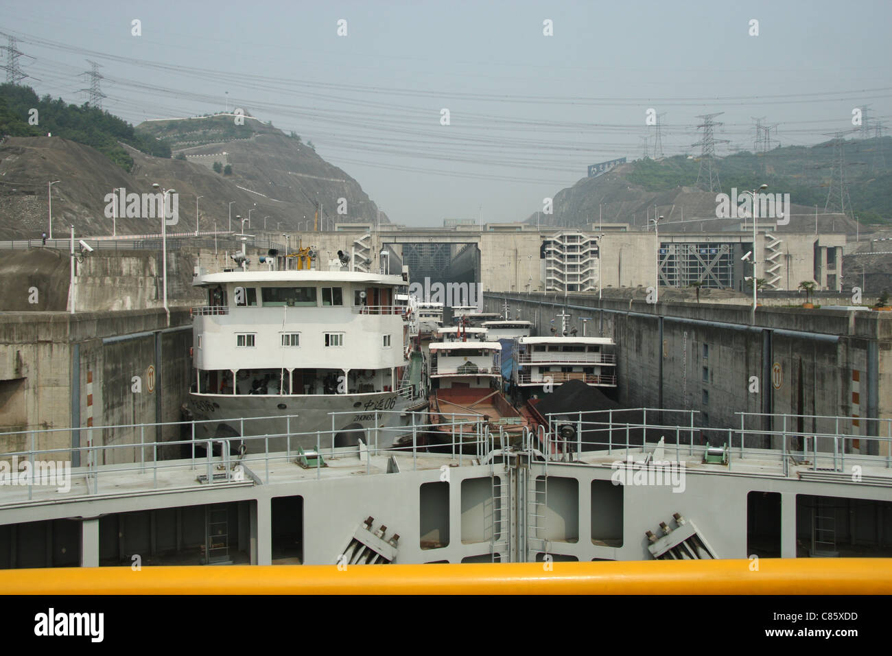 Freighter traffic heading downstream through the locks at Three Gorges Dam, Yangtze River, China Stock Photo