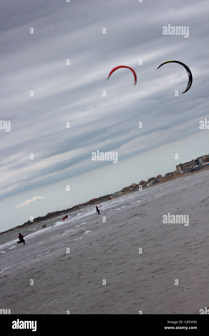 Kitesurfs in Sottomarina during a windy day Stock Photo