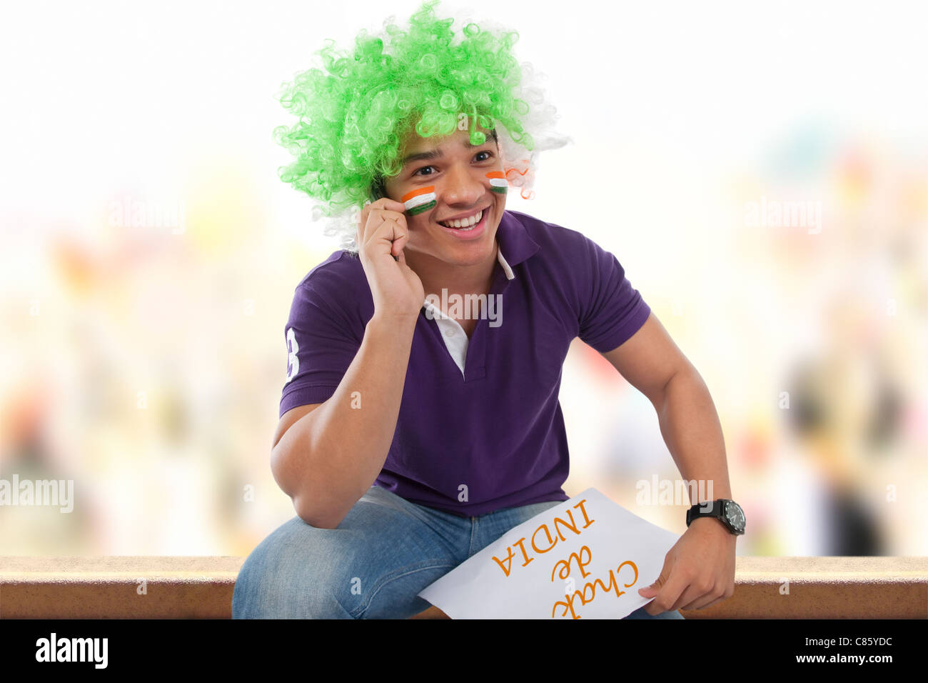 Boy with a wig talking on a mobile phone Stock Photo Alamy