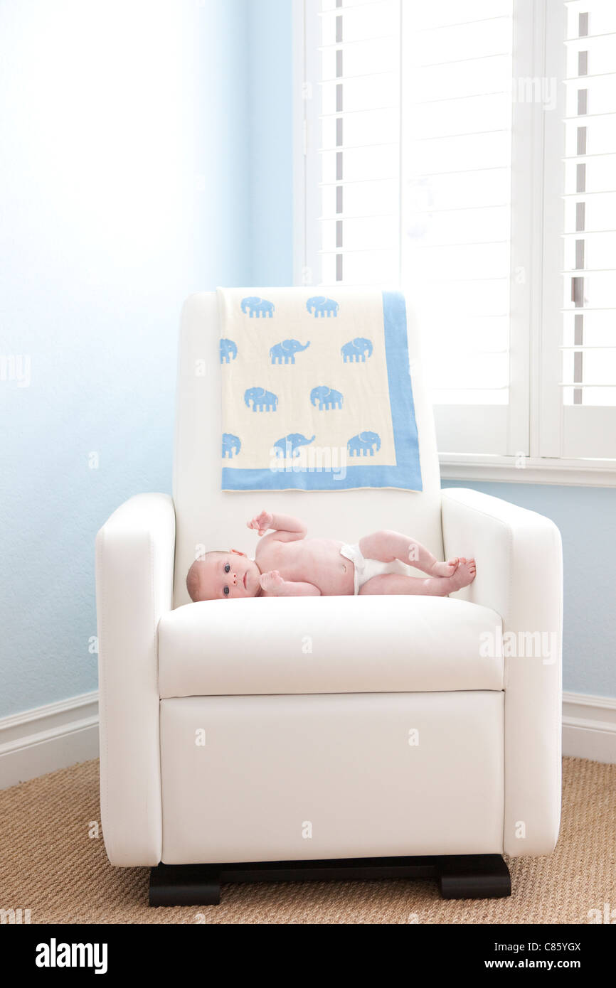 Small baby on rocking chair Stock Photo