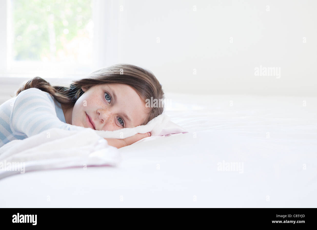 Little girl in her pajamas Stock Photo