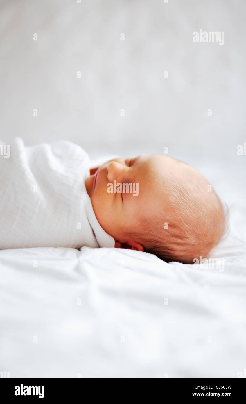 New swaddled sleeping baby Stock Photo Alamy