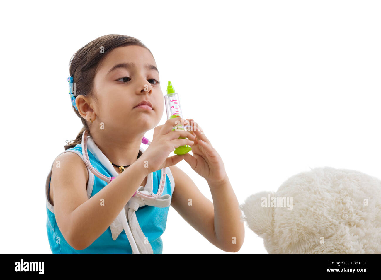 Girl with a toy injection playing doctor Stock Photo - Alamy