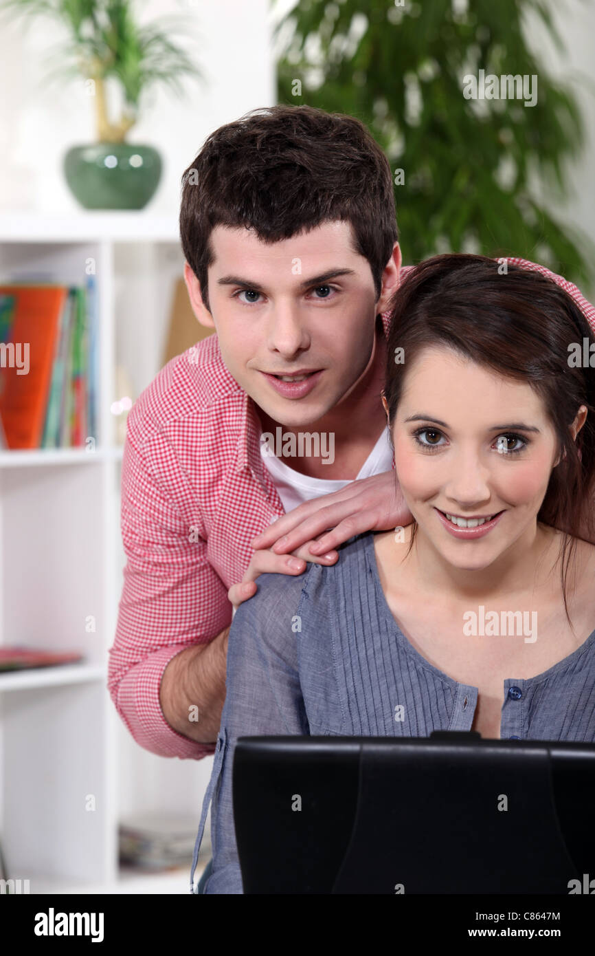 young couple home with laptop Stock Photo - Alamy