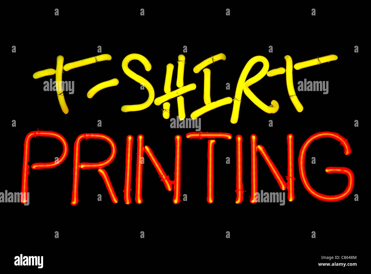 Tshirt printing neon sign isolated on black background Stock Photo
