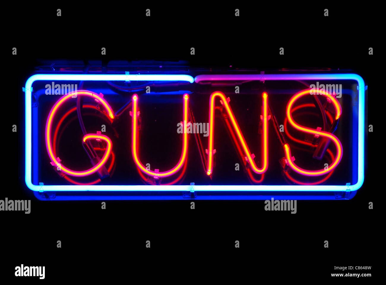 Guns neon sign isolated on black background Stock Photo