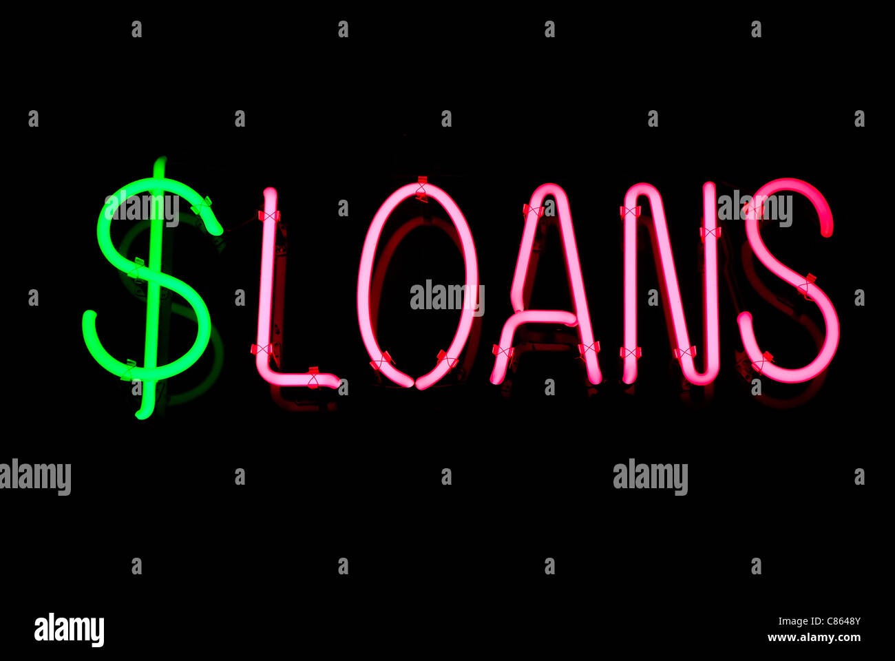 Pink loans and green dollar neon sign isolated on black background Stock Photo