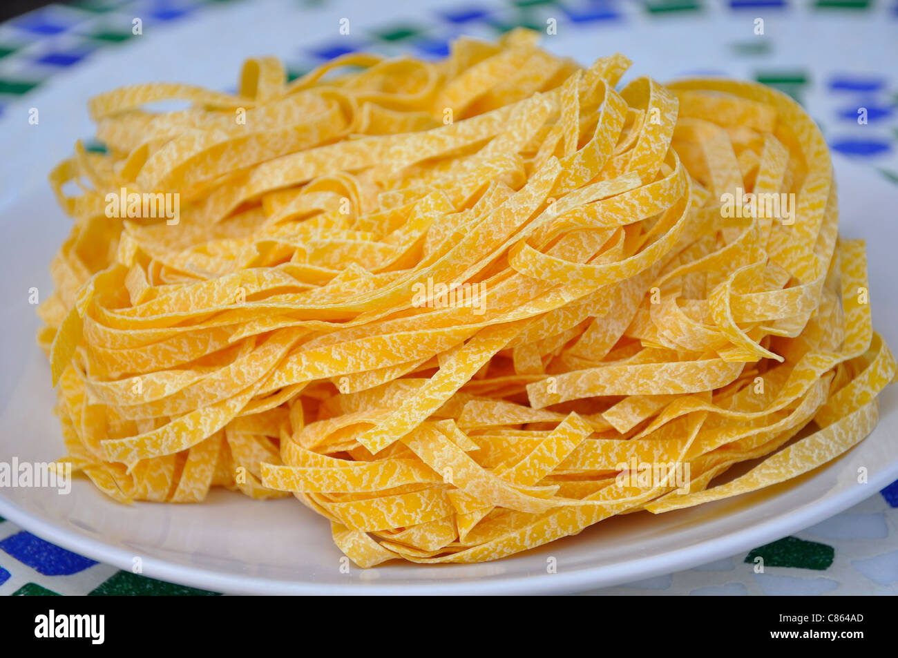 Dry egg pasta ready to be cooked Stock Photo Alamy