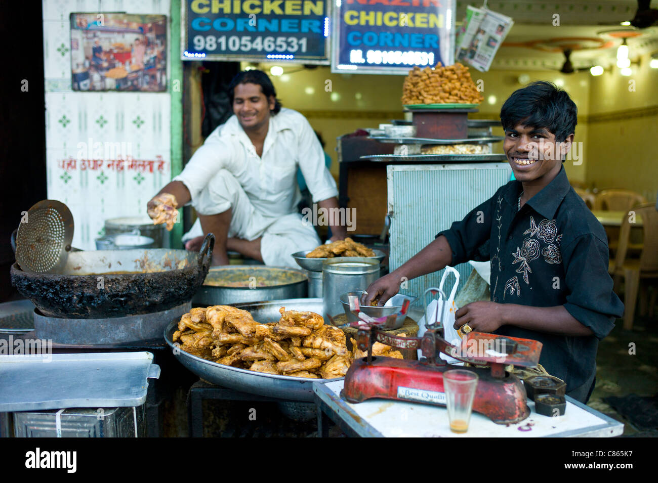 Food on sale at Chicken Corner in Snack market at muslim Meena Bazar, in Old Delhi, India Stock Photo