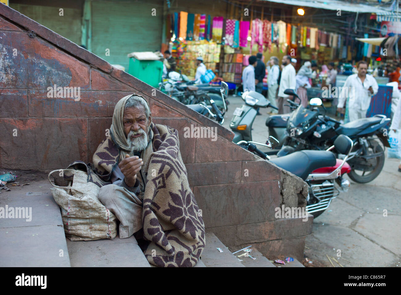 Indian beggar at muslim Meena Bazar, in Old Delhi, India Stock Photo