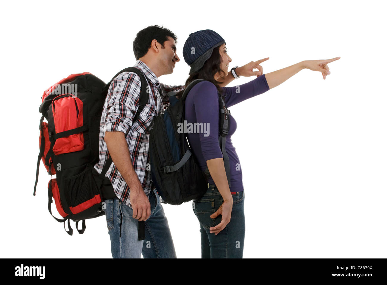 Couple in hiking gear pointing Stock Photo