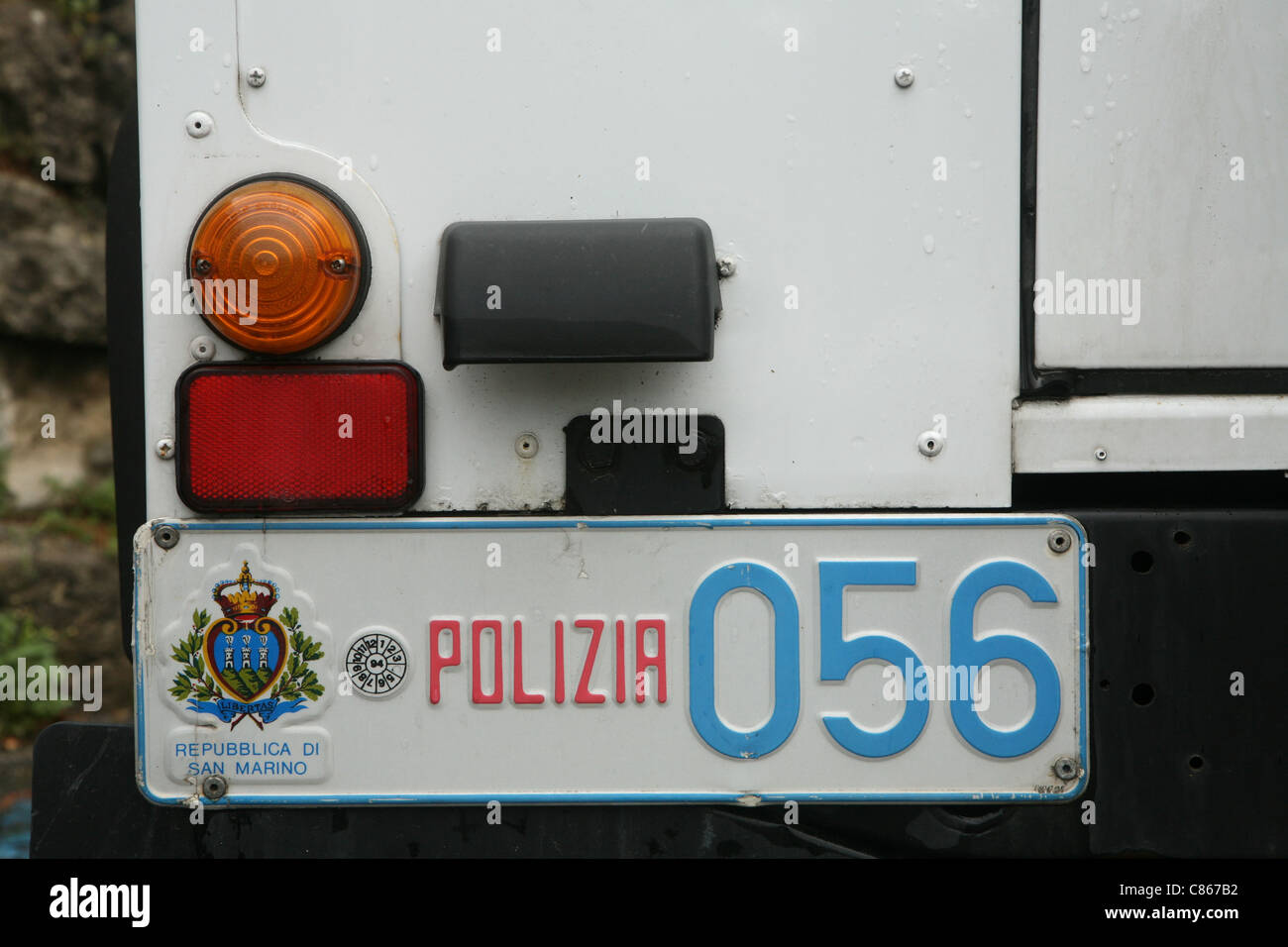 Coat of arms of the Republic of San Marino on the vehicle registration plate of a police car in the City of San Marino (Città di San Marino). Stock Photo