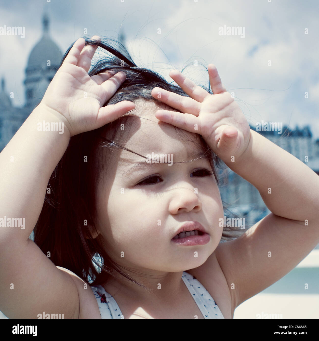 Little girl feeling hot under sun Stock Photo Alamy