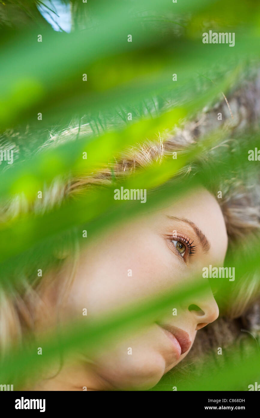 Woman contemplatively looking away Stock Photo - Alamy