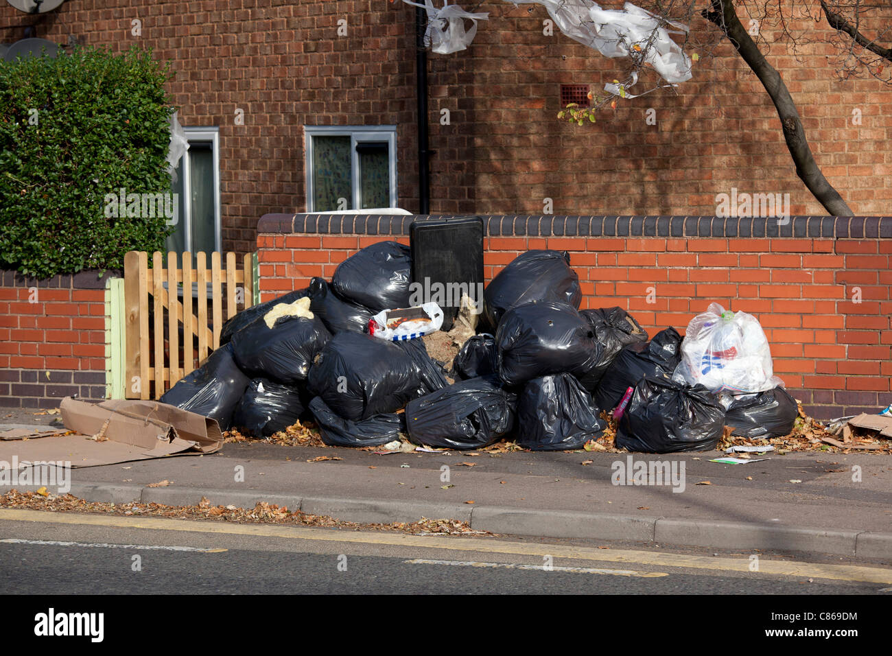 Rubbish, piled on the pavement in Victoria Road, Aston, Birmingham