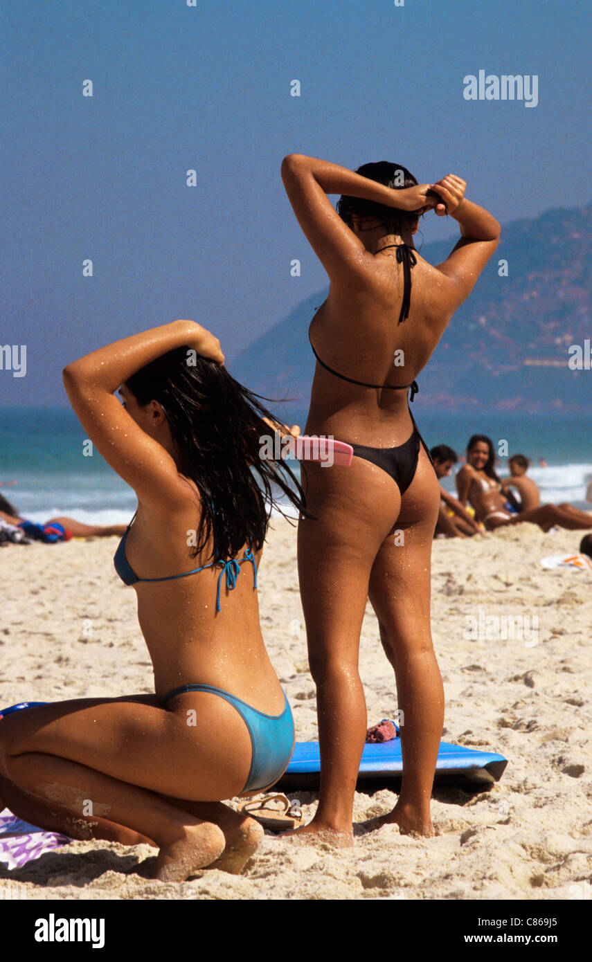 Rio de Janeiro, Brazil. Two women in bikinis on Ipanema beach Stock Photo -  Alamy