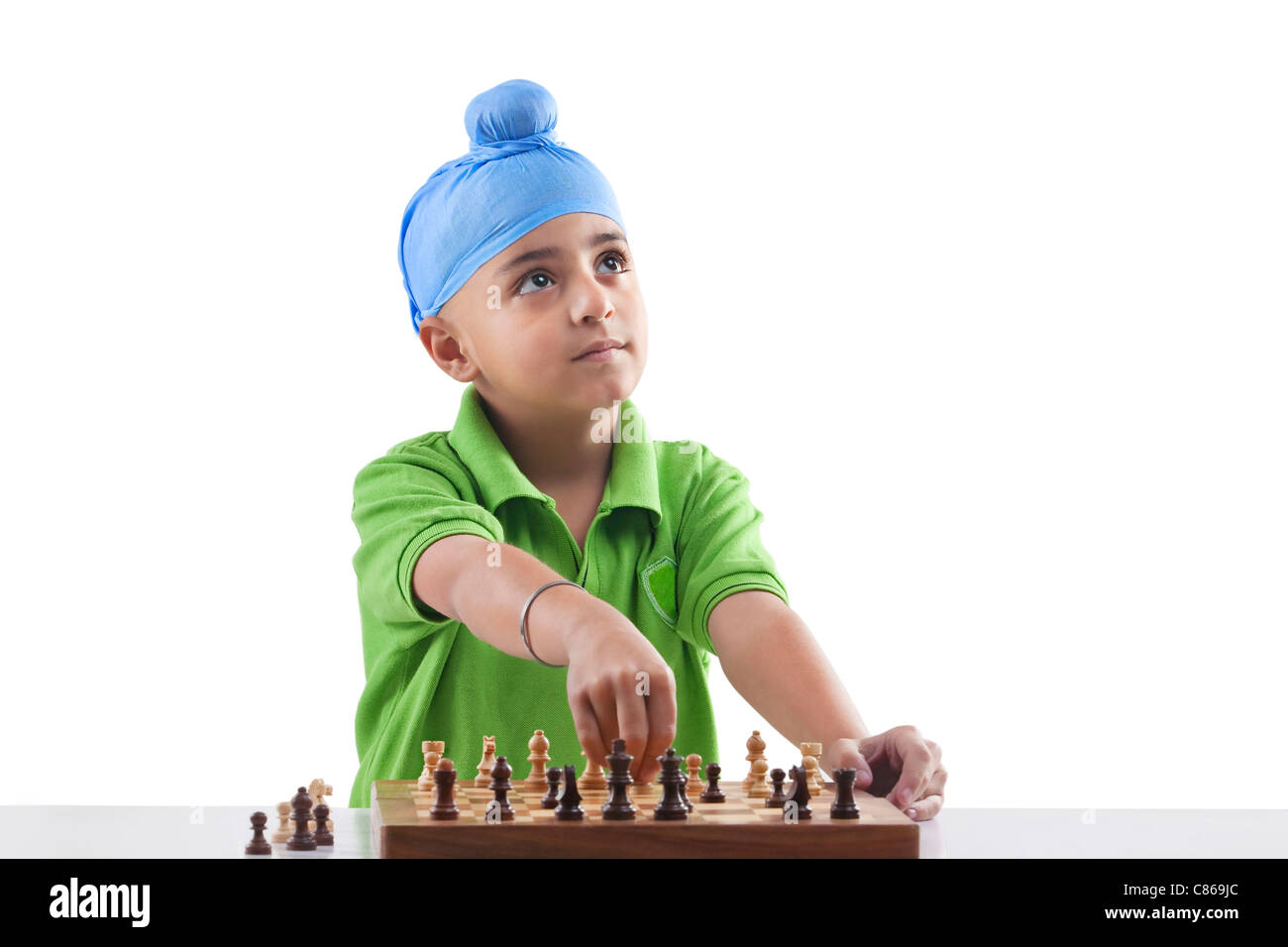 Sikh boy playing chess Stock Photo