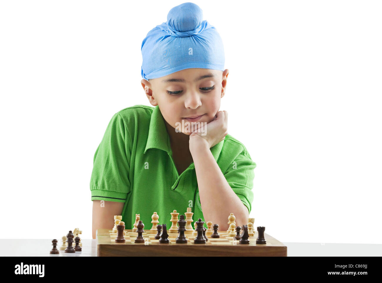 Sikh boy playing chess Stock Photo