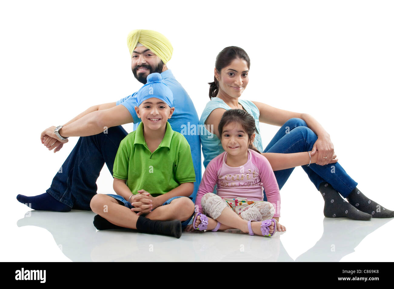 Sikh family sitting together Stock Photo