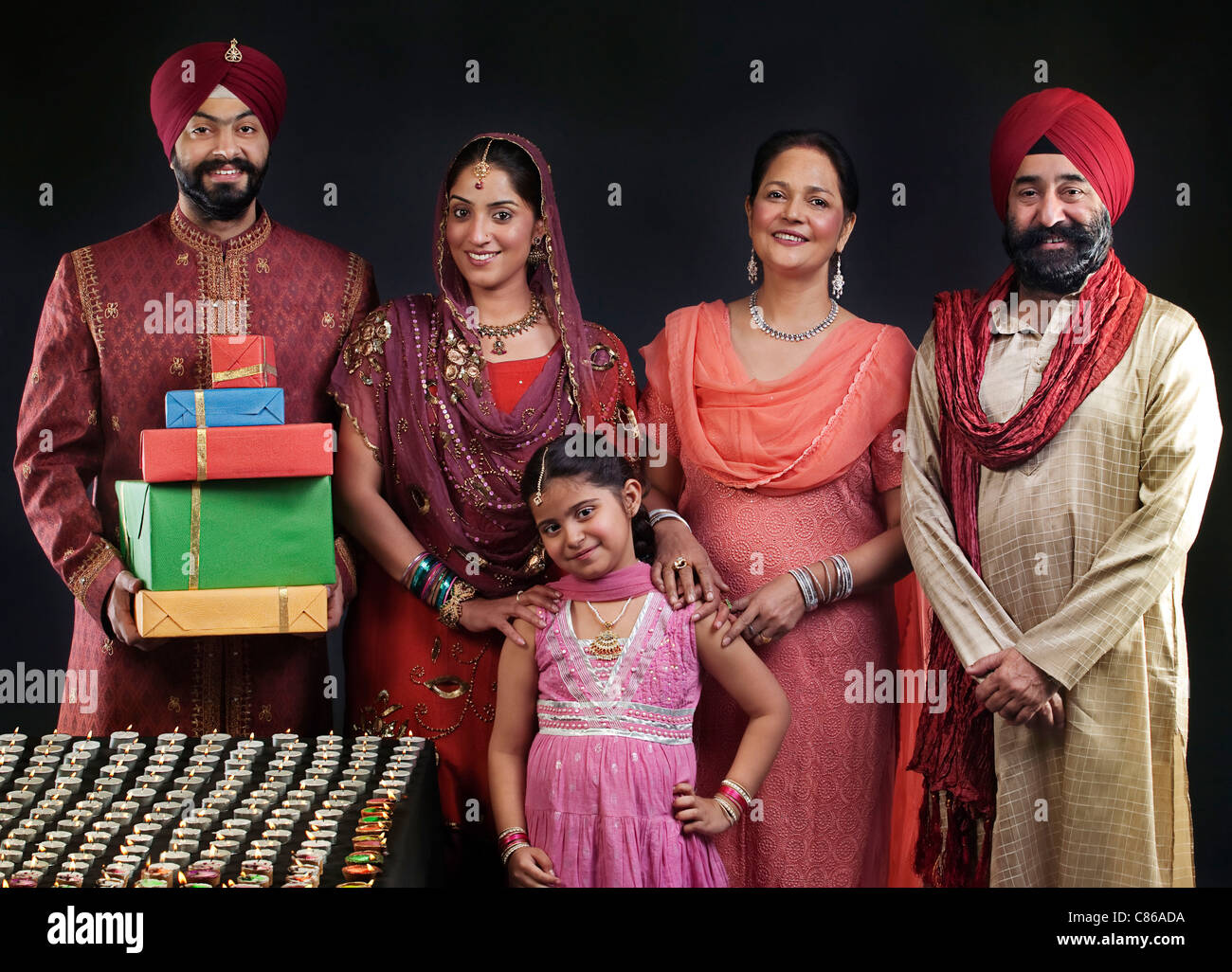 Portrait of a Sikh family with diyas Stock Photo