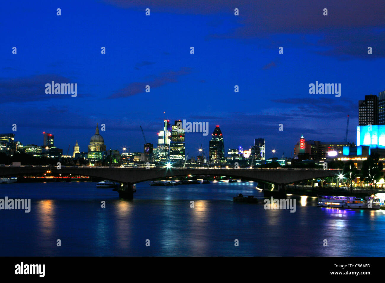 Looking across Waterloo Bridge at dusk to St Paul's Cathedral, the City of London and South Bank, London, UK Stock Photo