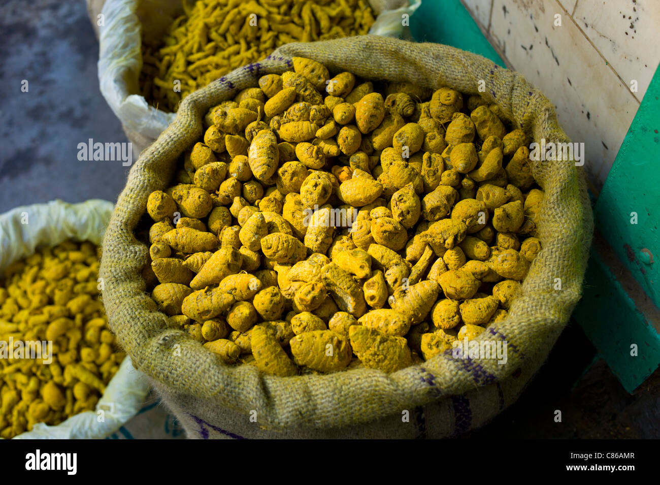 Yellow turmeric on sale at Khari Baoli spice and dried foods market, Old Delhi, India Stock Photo