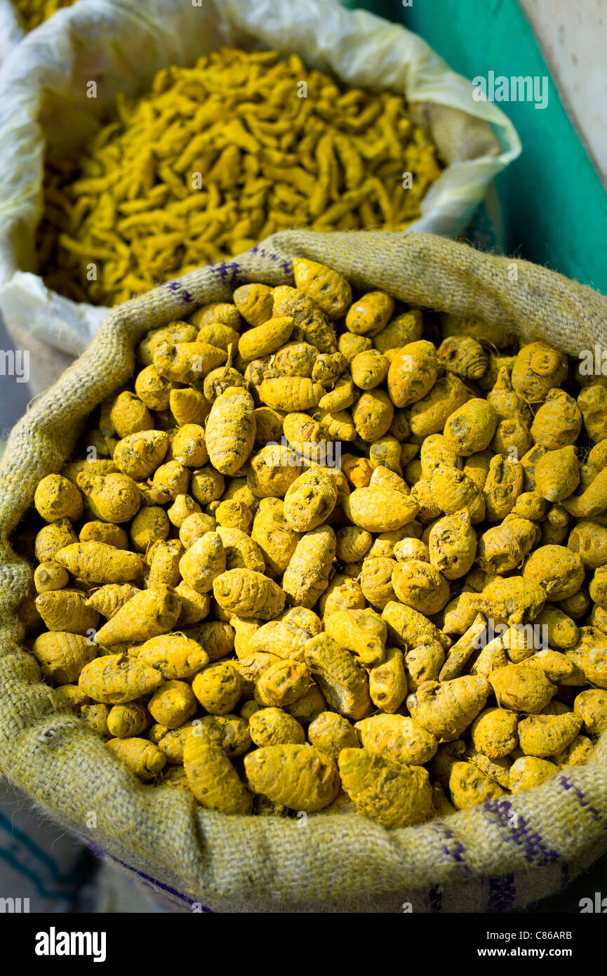Yellow turmeric on sale at Khari Baoli spice and dried foods market, Old Delhi, India Stock Photo