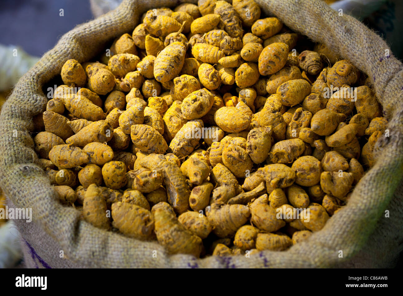 Yellow turmeric on sale at Khari Baoli spice and dried foods market, Old Delhi, India Stock Photo