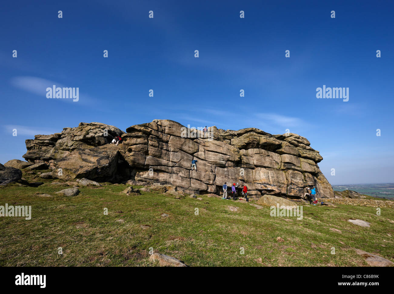 Rock climbers at Almscliffe Crag, North Yorkshire Stock Photo
