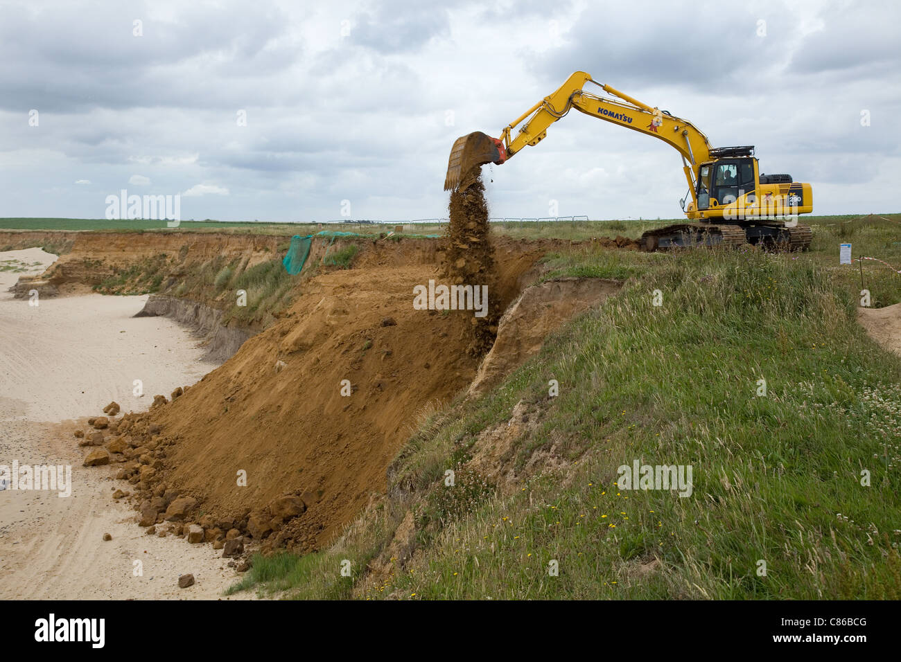 Komatsu PC 290 LC tracked 360 excavator at work on a coastal erosion project  in Norfolk,UK . Stock Photo