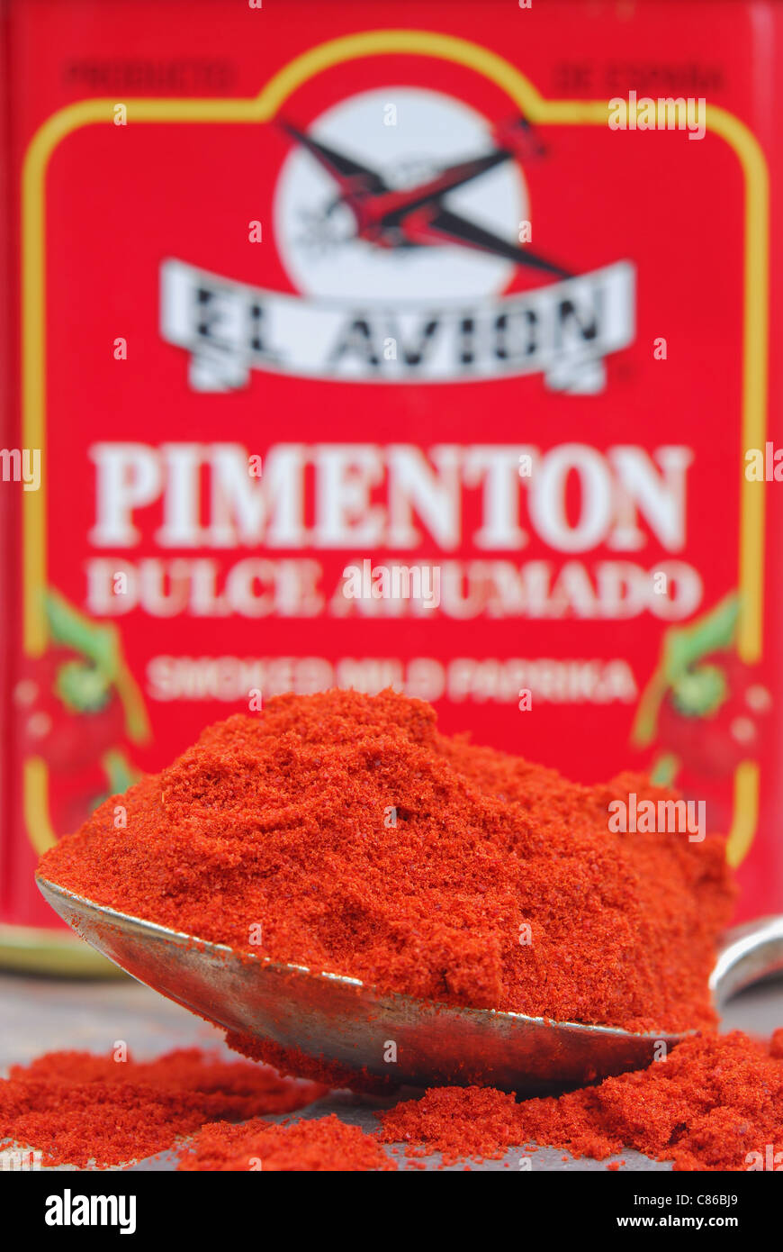 A spoon and tin of Spanish smoked mild paprika powder (pimenton dulce