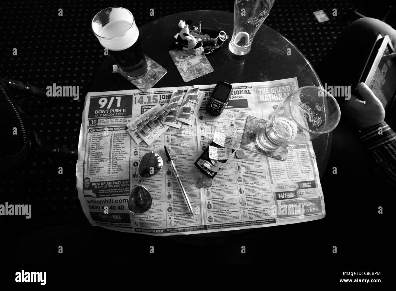 Pub table during the Grand National horse race at Aintree, Liverpool 2011 Stock Photo