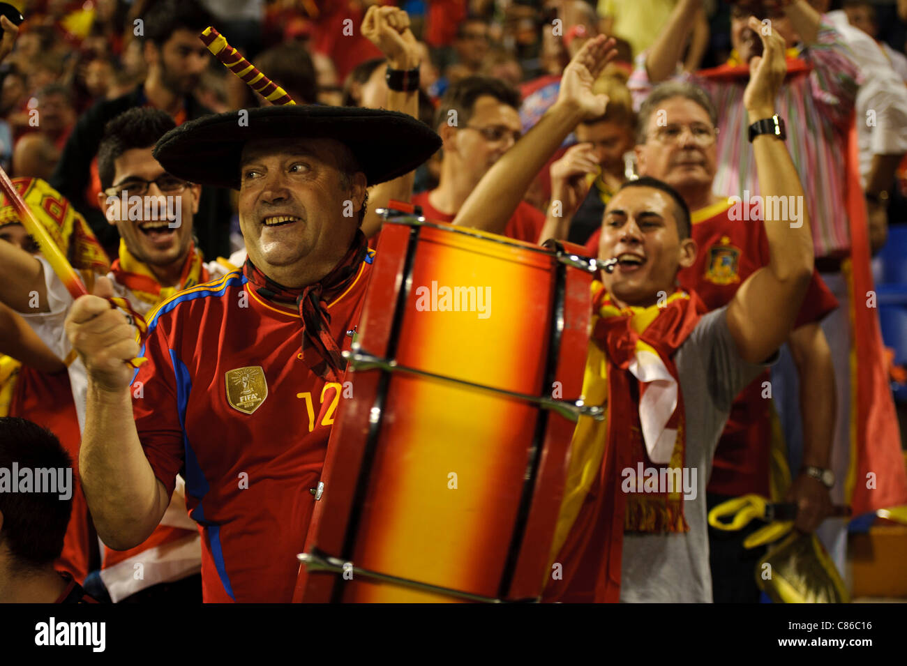 Spain fan Manolo plays his drum with the fans Stock Photo