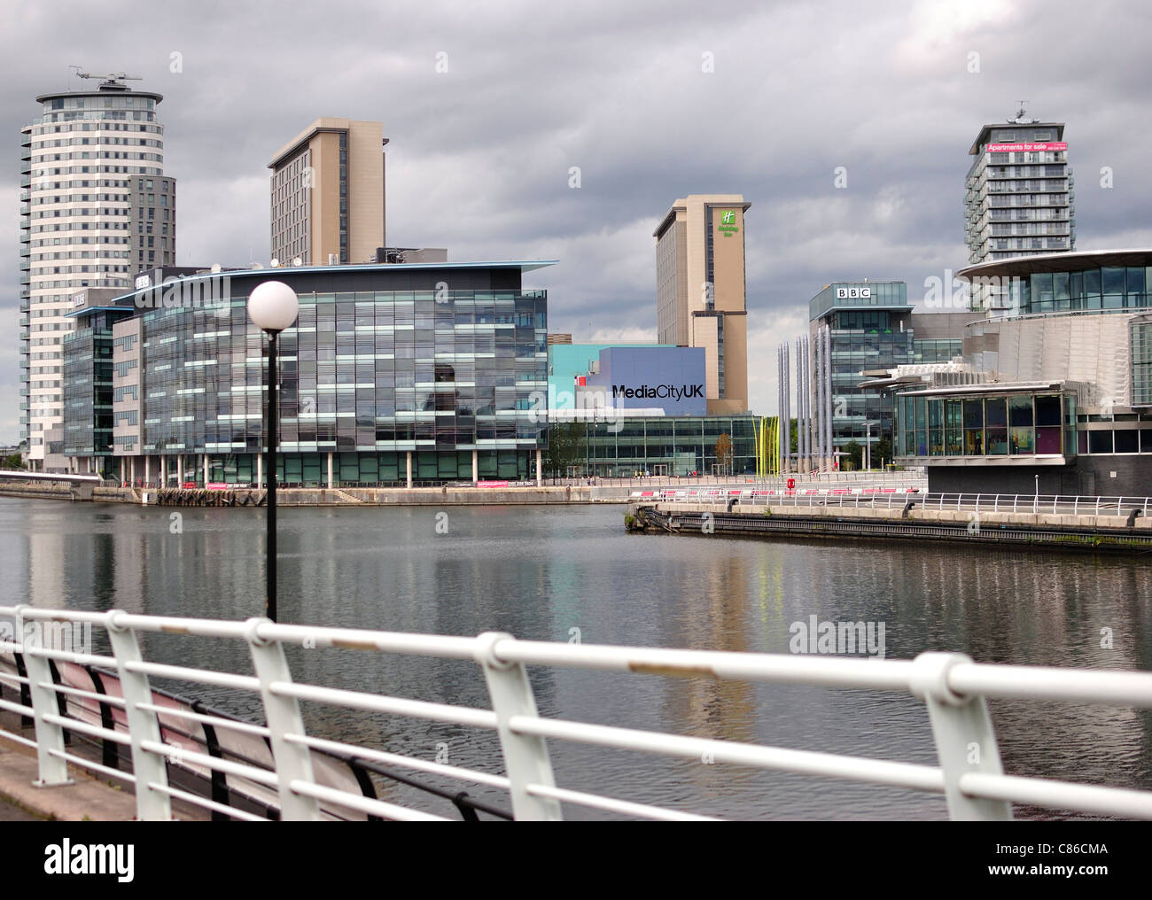 Grey cloudy skies over the BBC at MediaCityUK in Salford, Greater Manchester Stock Photo