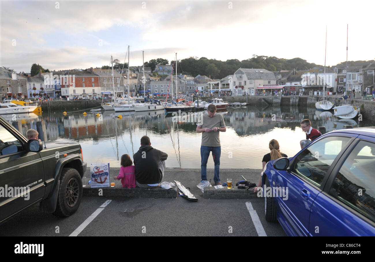 A family crab fishing early evening in Padstow, Cornwall Stock Photo