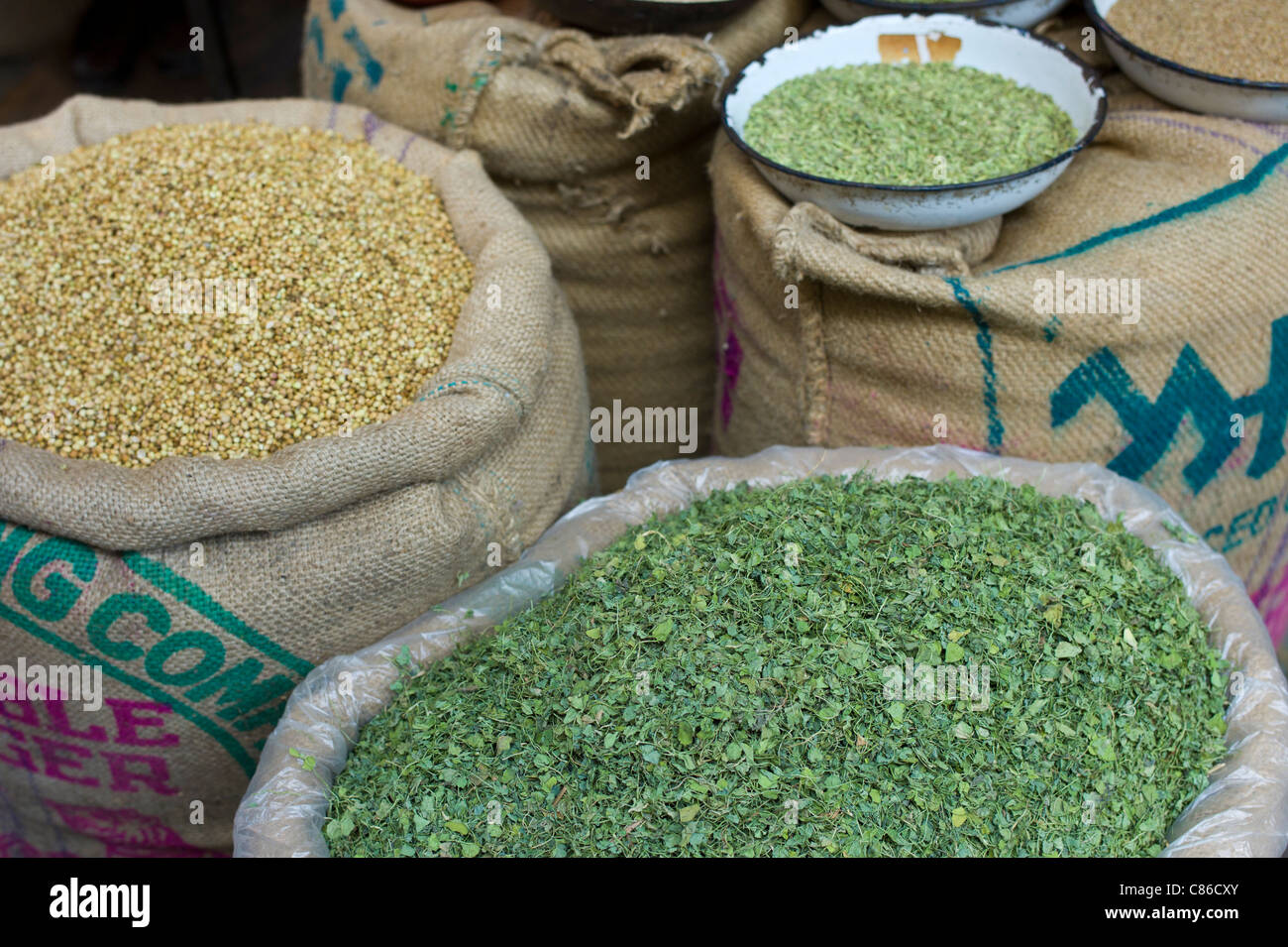 Coriander seeds and dried fenugreek leaves on sale at Khari Baoli spice and dried foods market, Old Delhi, India Stock Photo