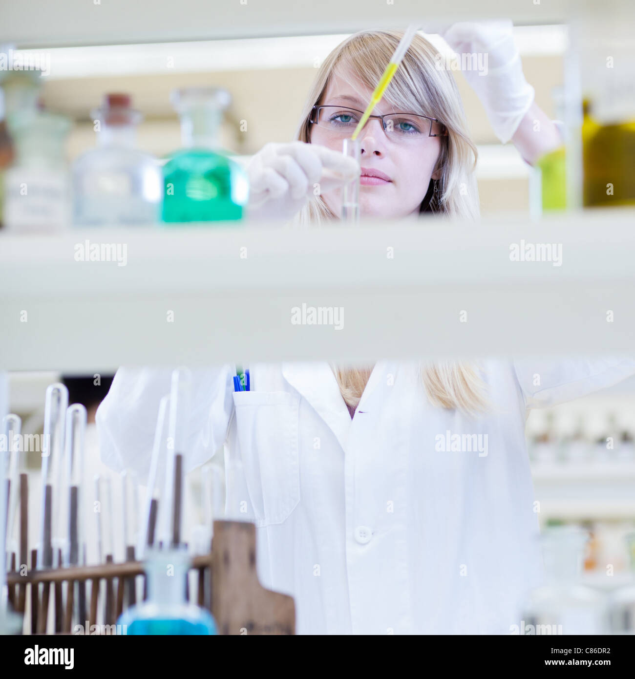 Portrait of a female researcher in a chemistry lab/laboratory (color