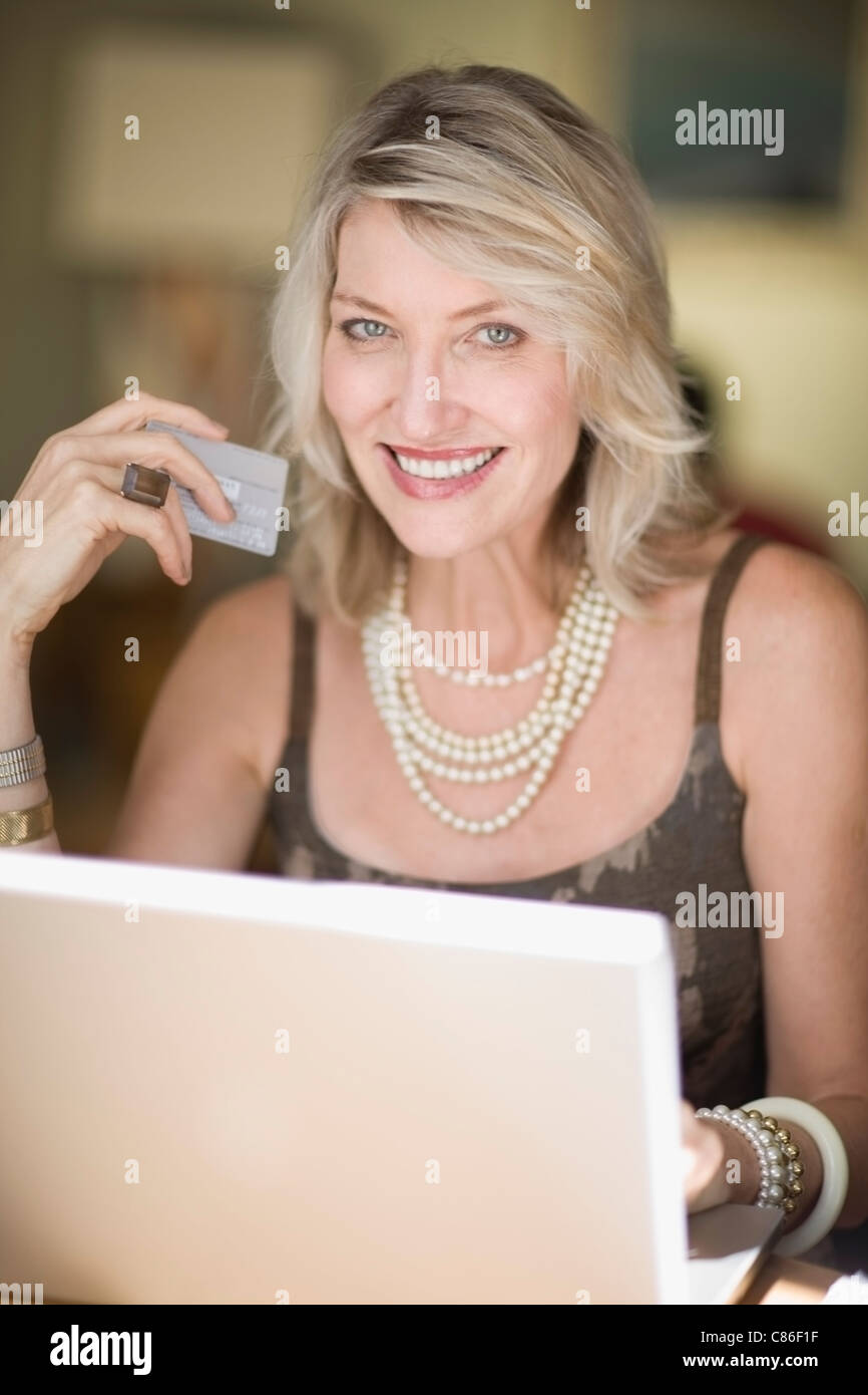 Older woman shopping on the internet Stock Photo