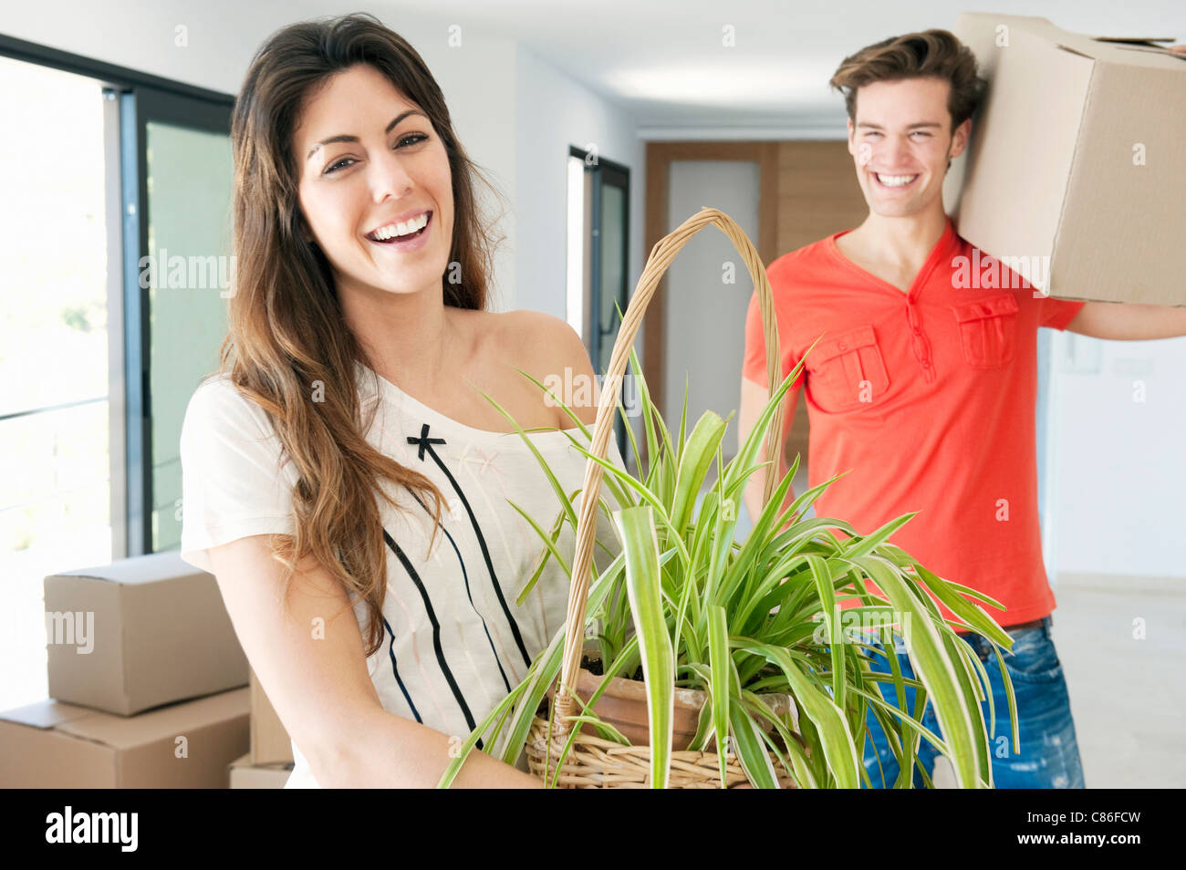 Couple moving into new home Stock Photo - Alamy