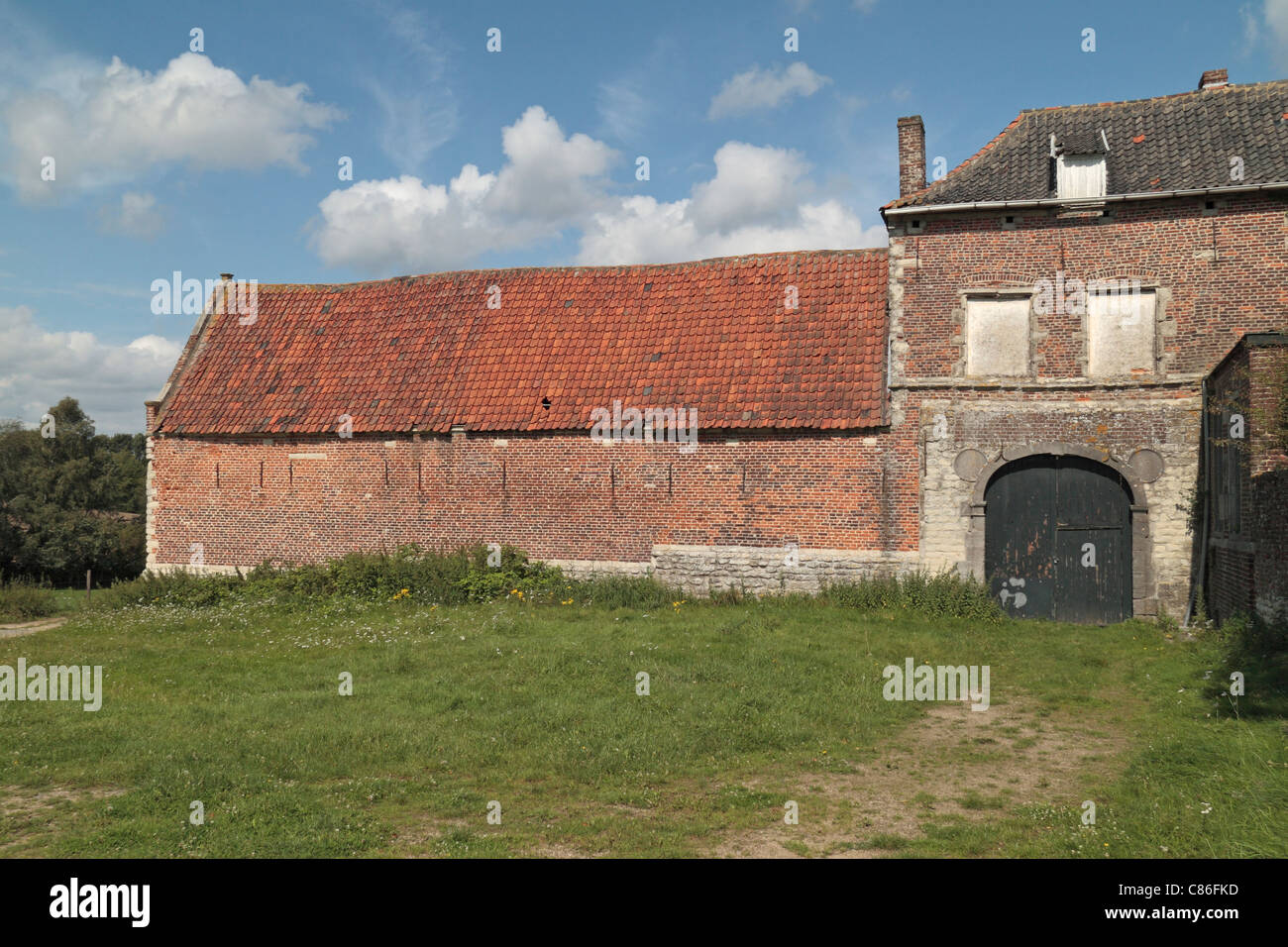 Mid afternoon view of the south gate at the Hougoumont farm house, on the Waterloo battlefield, Belgium. Stock Photo