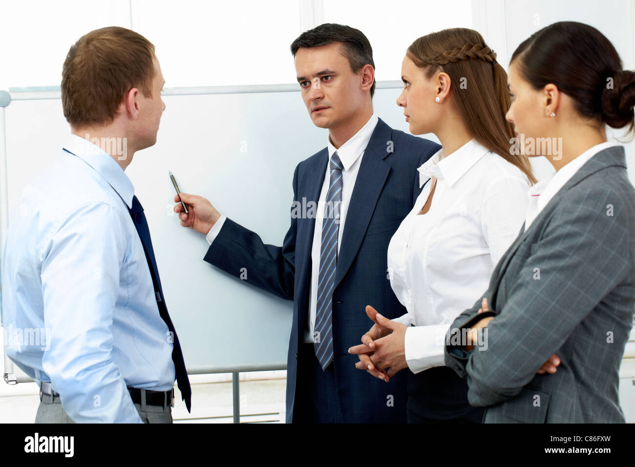 Smart confident boss pointing whiteboard hi-res stock photography and ...
