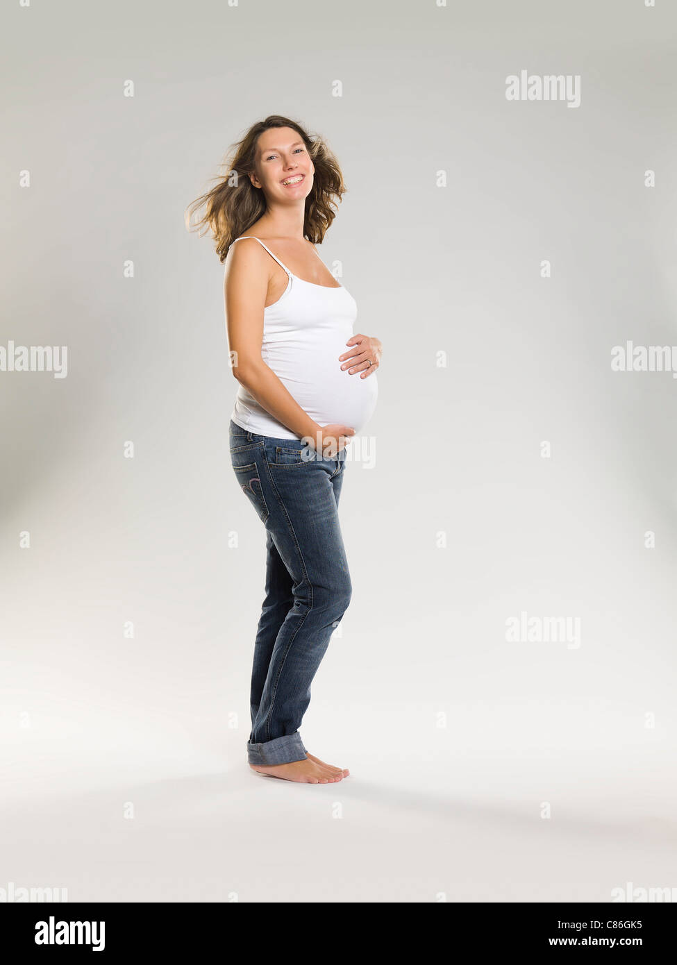 Pregnant woman holding belly Stock Photo Alamy