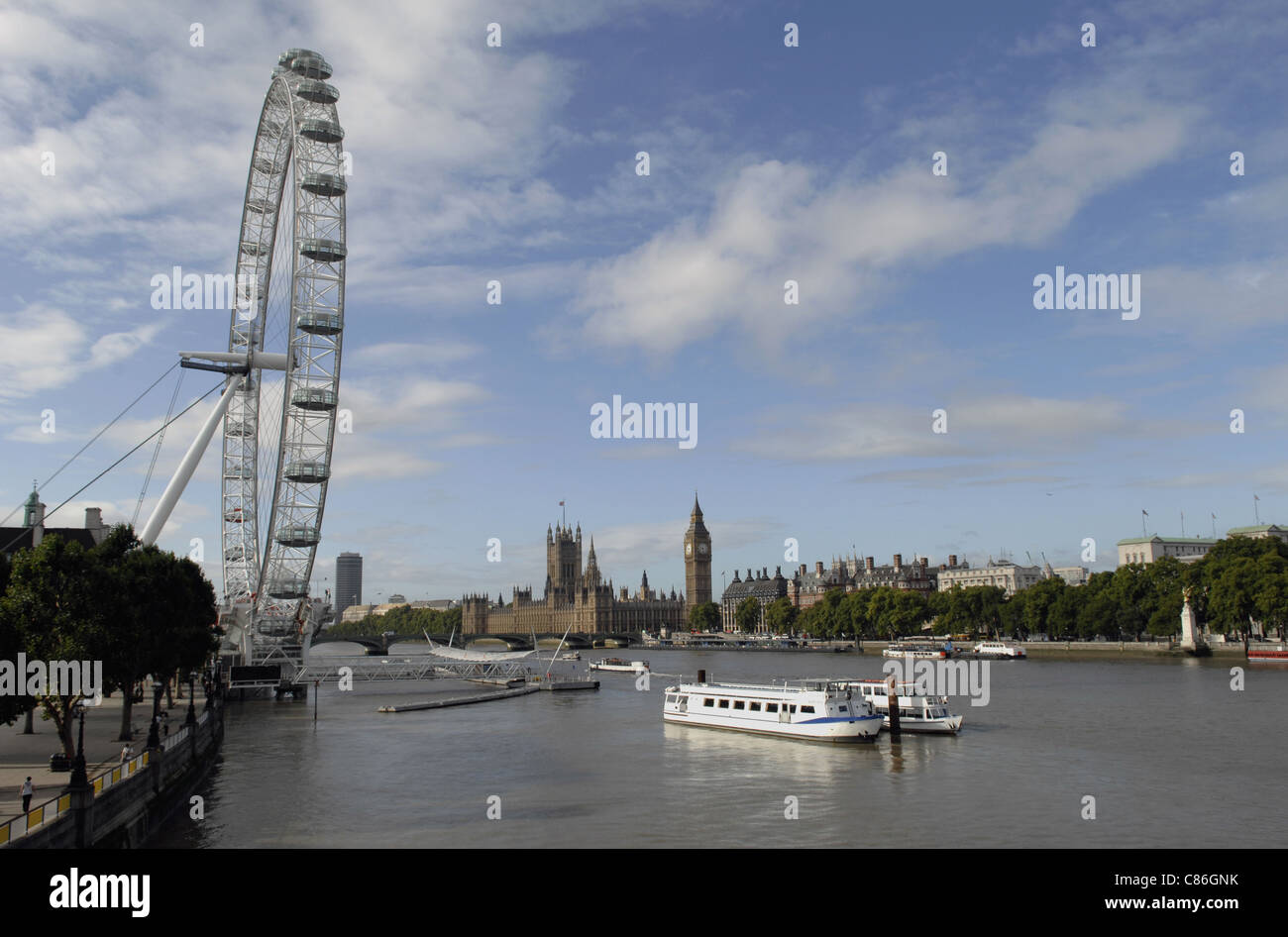 The River Thames looking West towards the London Eye and Westminster. Taken from the Golden Jubilee Footbridge. Stock Photo