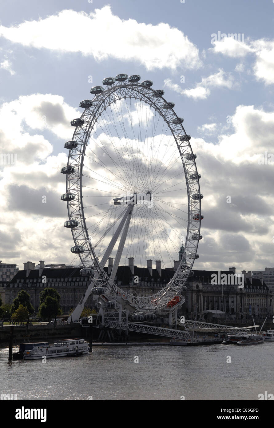 The London Eye situated on the River Thames. A popular tourist attraction, affording spectacular views across The Capital. Stock Photo