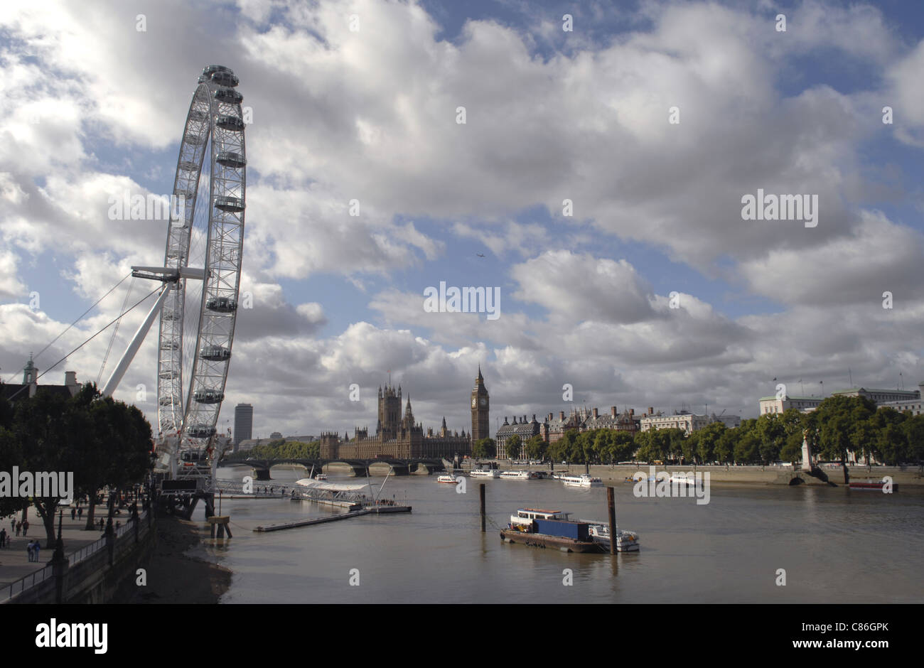 The River Thames looking West towards the London Eye and Westminster. Taken from the Golden Jubilee Footbridge. Stock Photo
