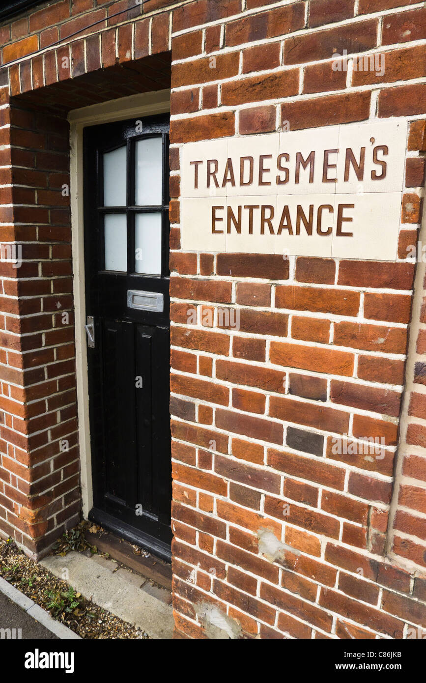 Doorway with a sign saying 'Tradesmen's Entrance.' Stock Photo