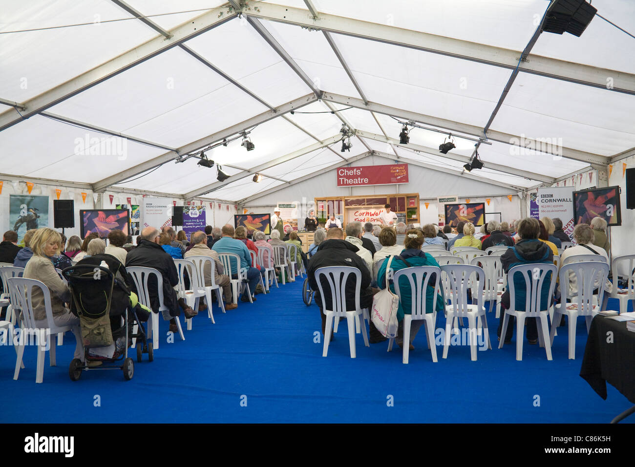 Audience in the Chefs Theatre watching a demonstration of food preparation at Cornish Food and Drink Festival Stock Photo