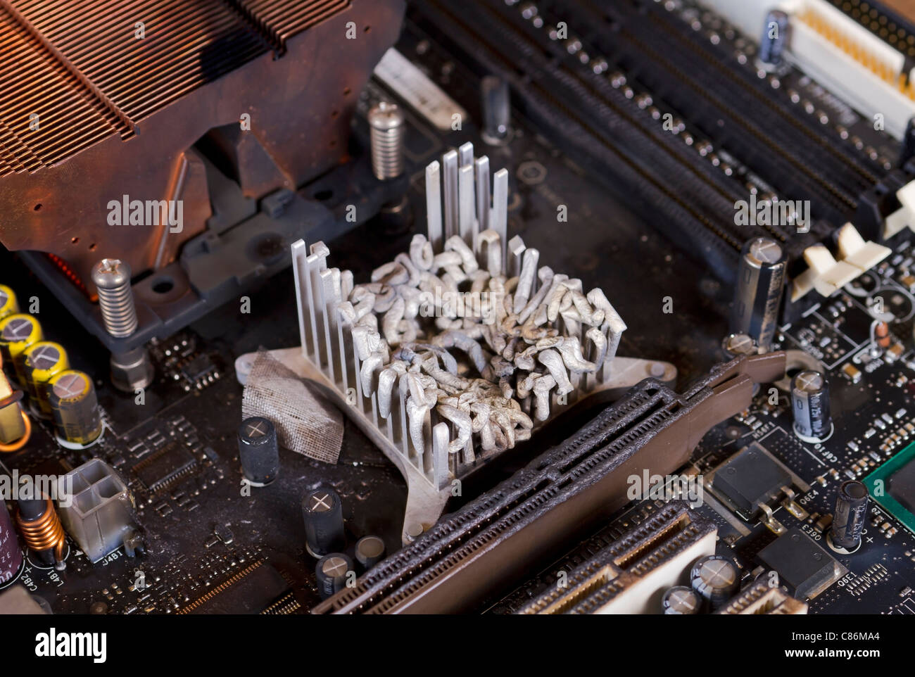 main board detail with molten heat sink Stock Photo