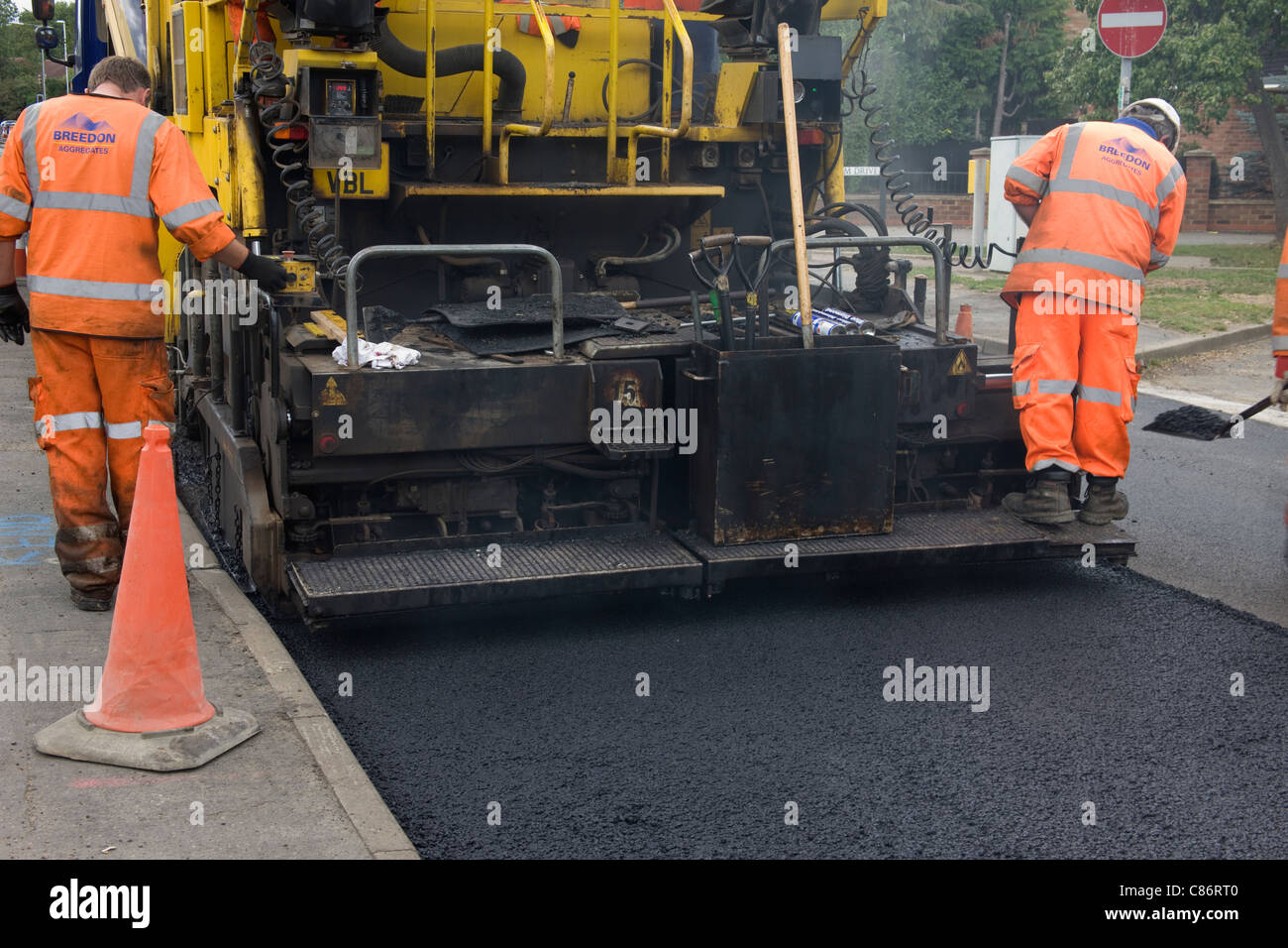 Tarmac machine laying new road surface Stock Photo Alamy
